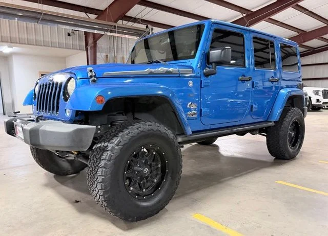 Used 2014 Blue Jeep Unlimited Sahara image 8
