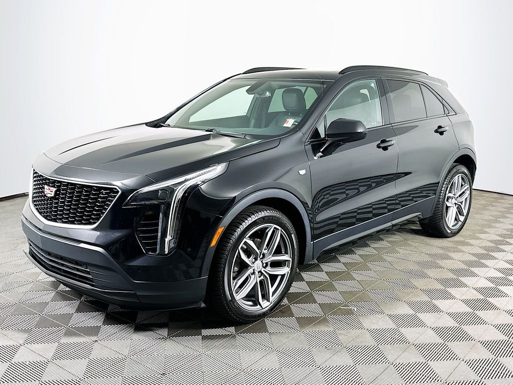 Used 2019 Stellar Black Metallic Cadillac Sport image 1