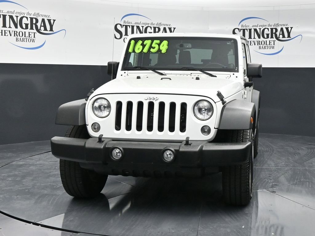 Used 2014 Jeep Wrangler Sport with VIN 1C4AJWAG7EL101073 for sale in Bartow, FL