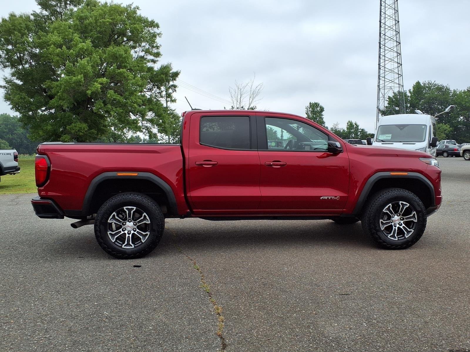 Used 2025 Volcanic Red Tintcoat GMC 4WD AT4 image 11