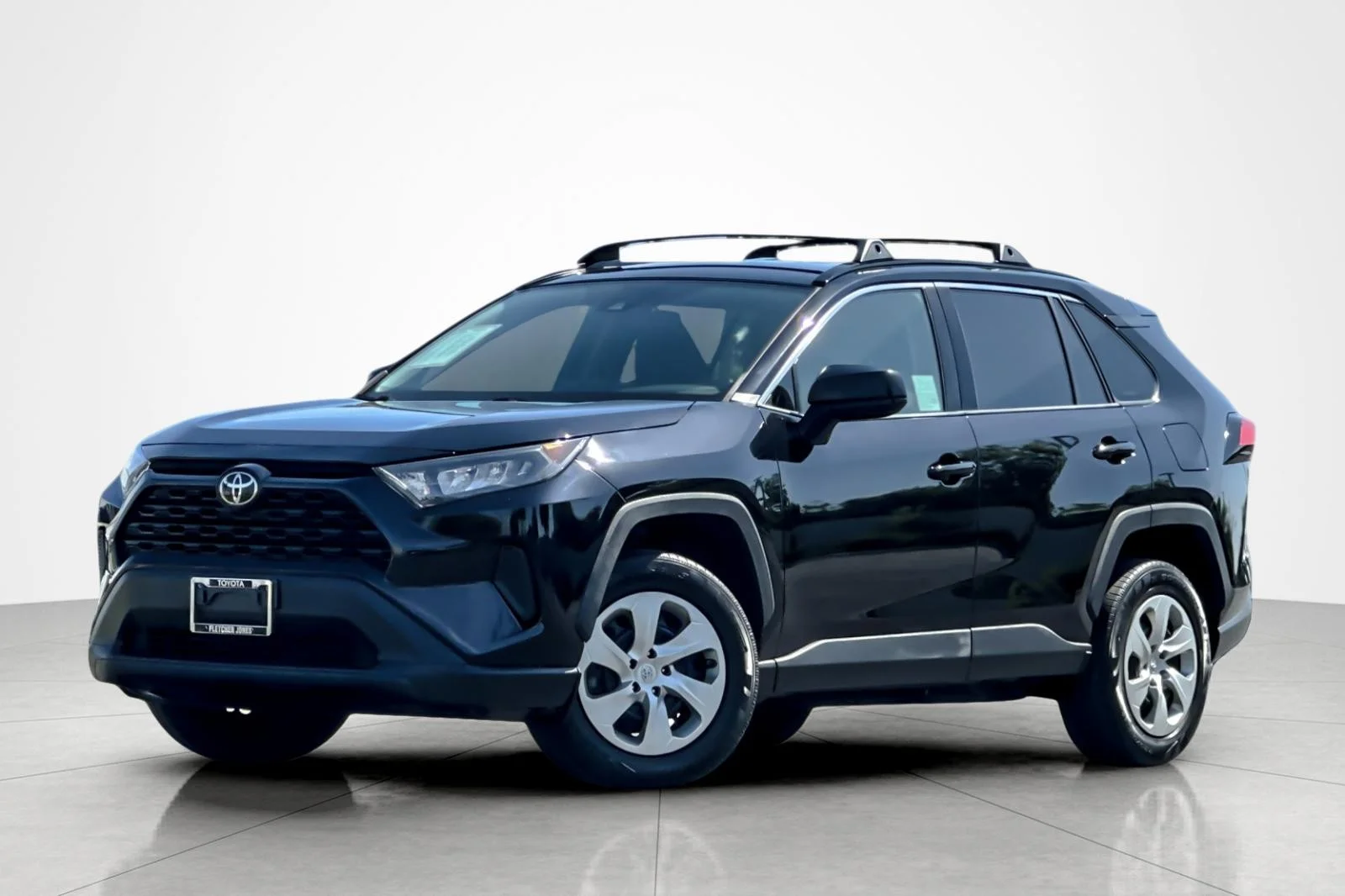Used 2021 MIDNIGHT BLACK Toyota LE image 1