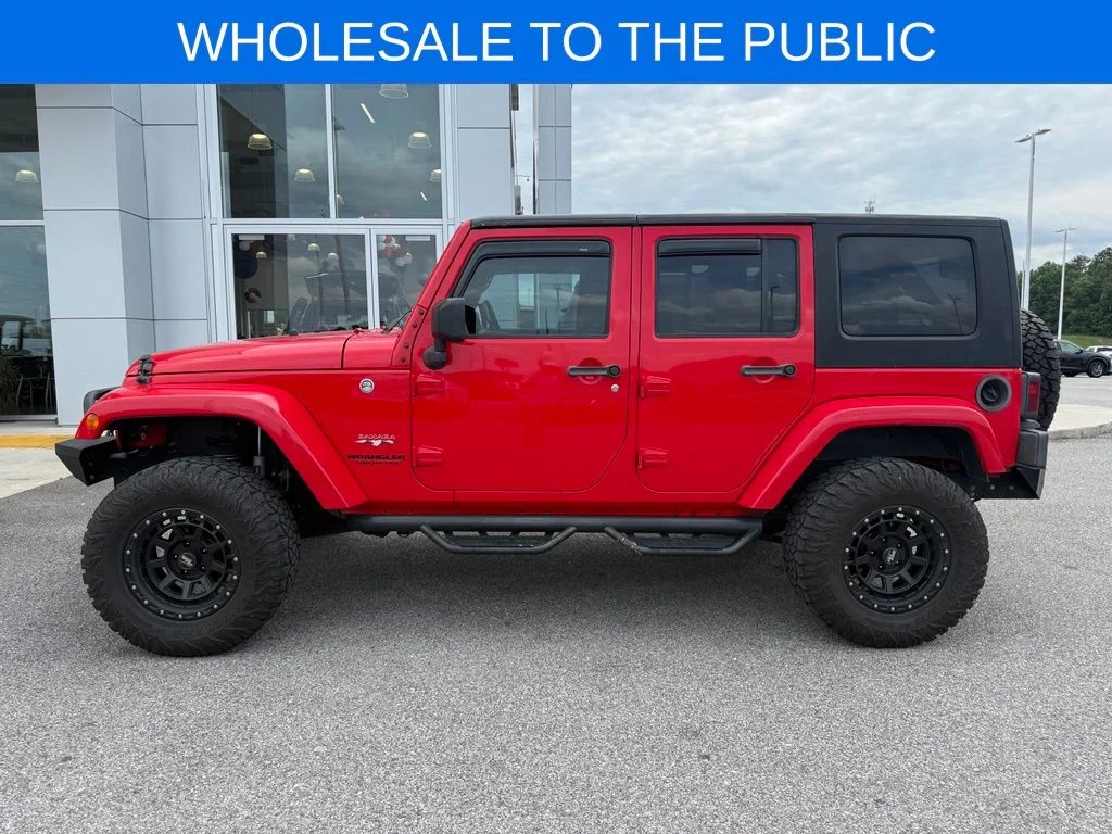 Used 2016 Red Jeep Unlimited Sahara image 2