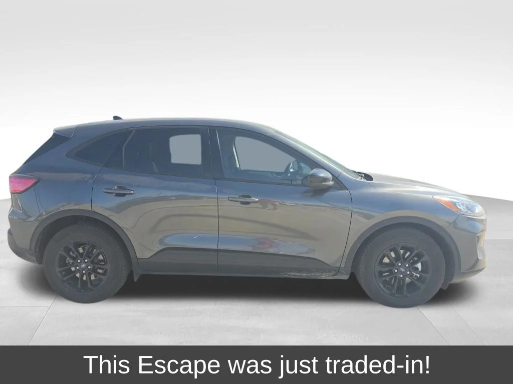 Used 2020 Magnetic Metallic Ford SE Sport image 1