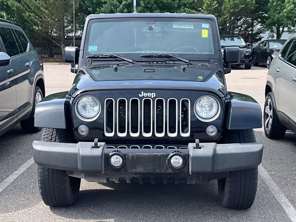 Used 2016 Black Jeep Unlimited Sahara image 2