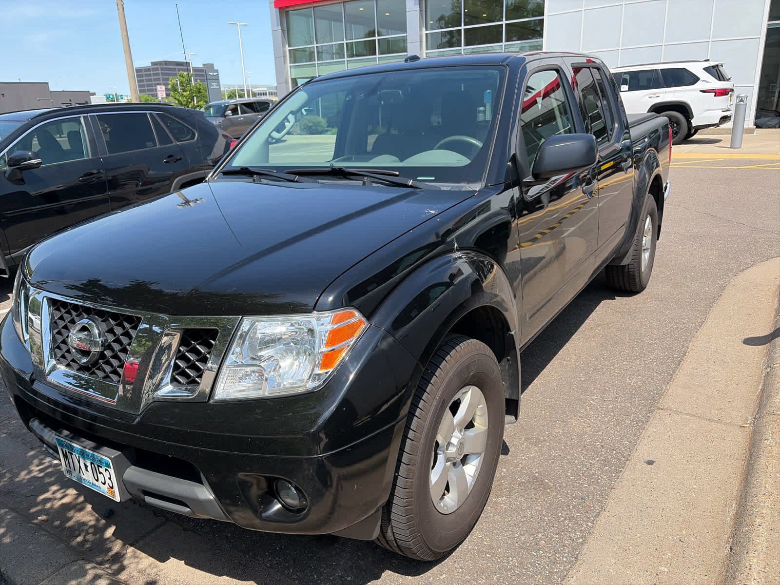 Used 2013 Super Black Nissan SV image 2