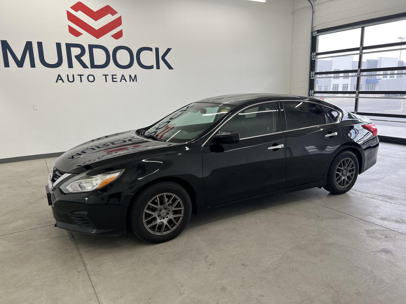 Used 2016 Super Black Nissan 2.5 S image 1