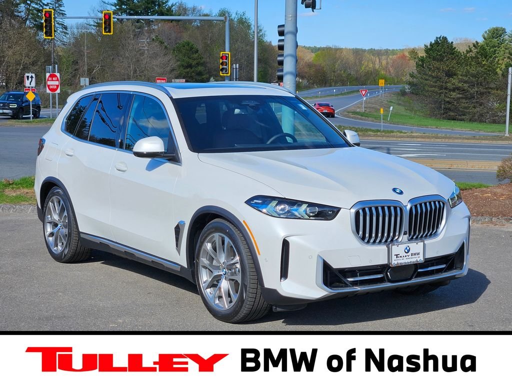 New 2026 Mineral White Metallic BMW xDrive50e image 1