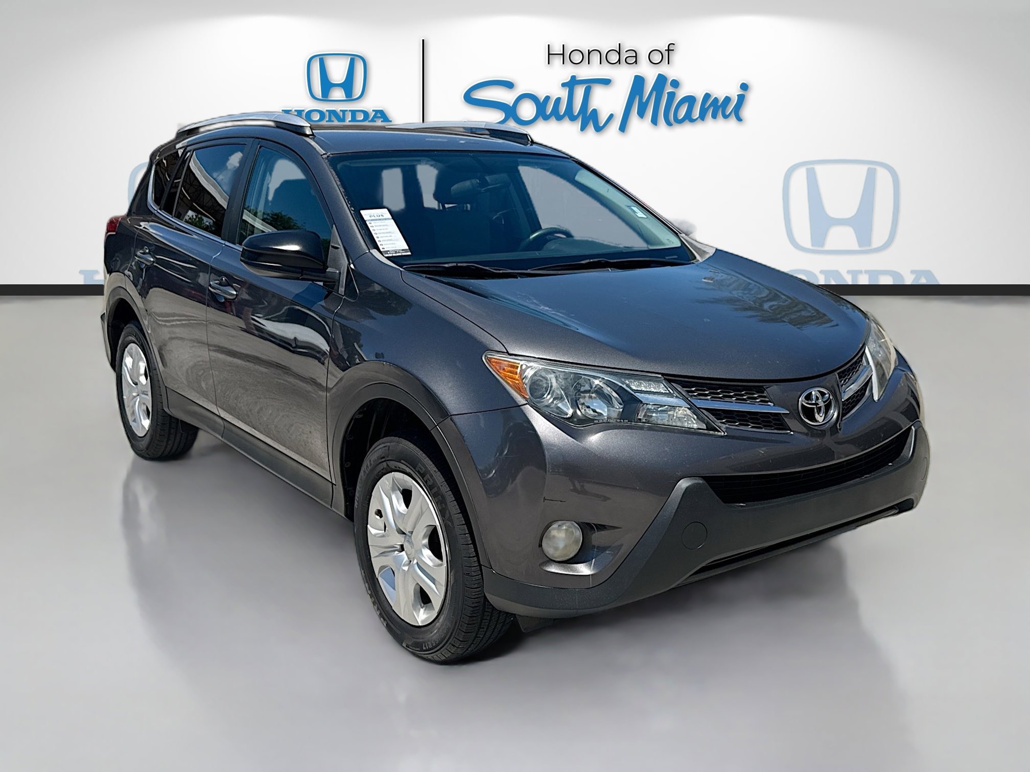 Used 2015 Magnetic Gray Metallic Toyota LE image 1