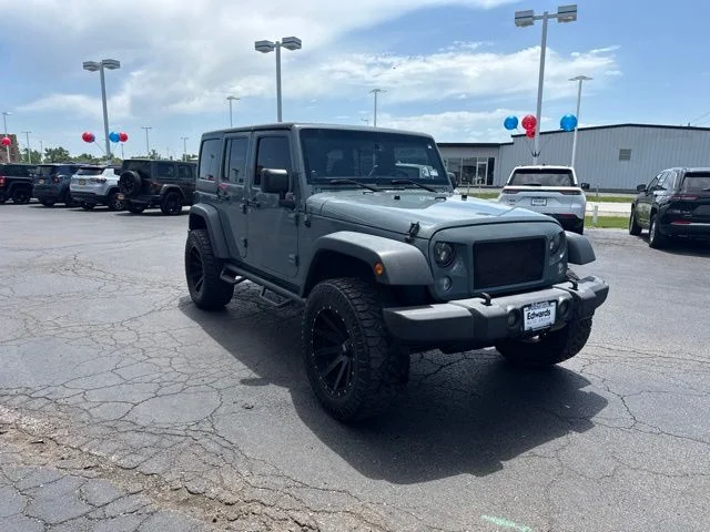 Used 2014 Gray Jeep Unlimited Sport image 1