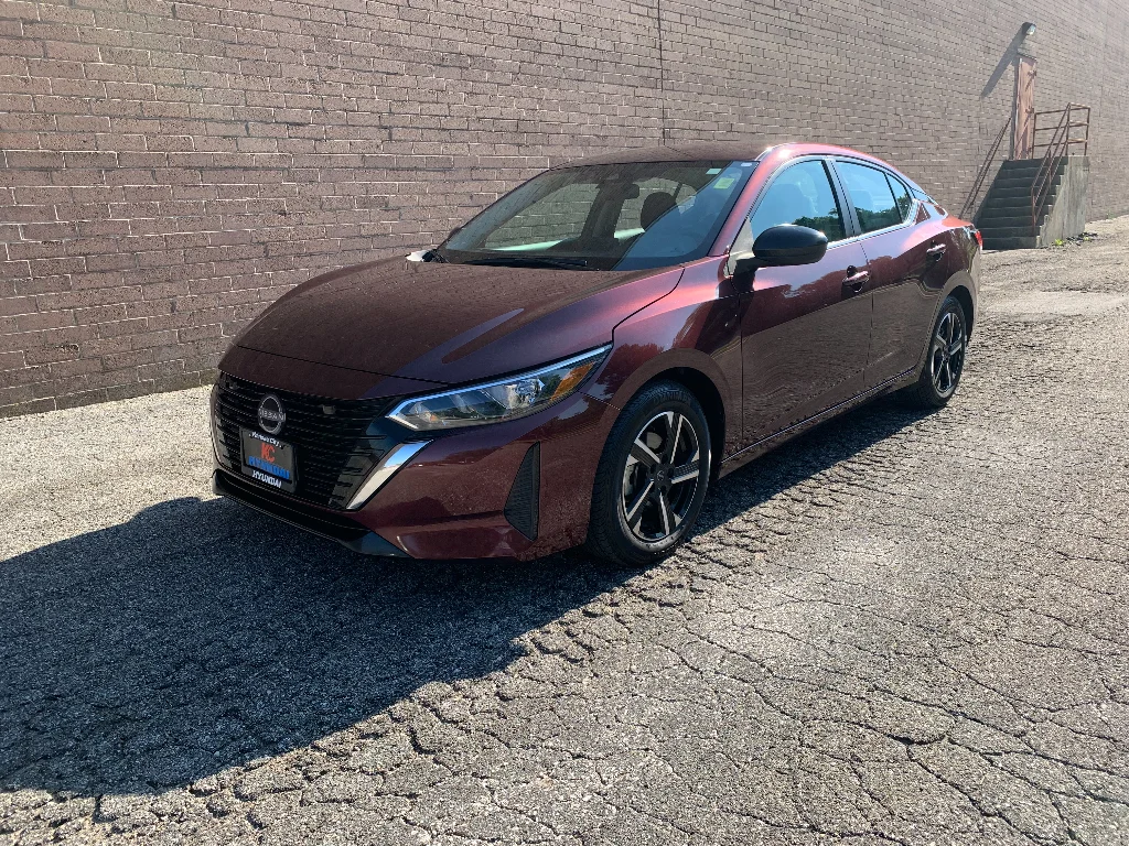 Used 2024 Rosewood Metallic Nissan SV image 1