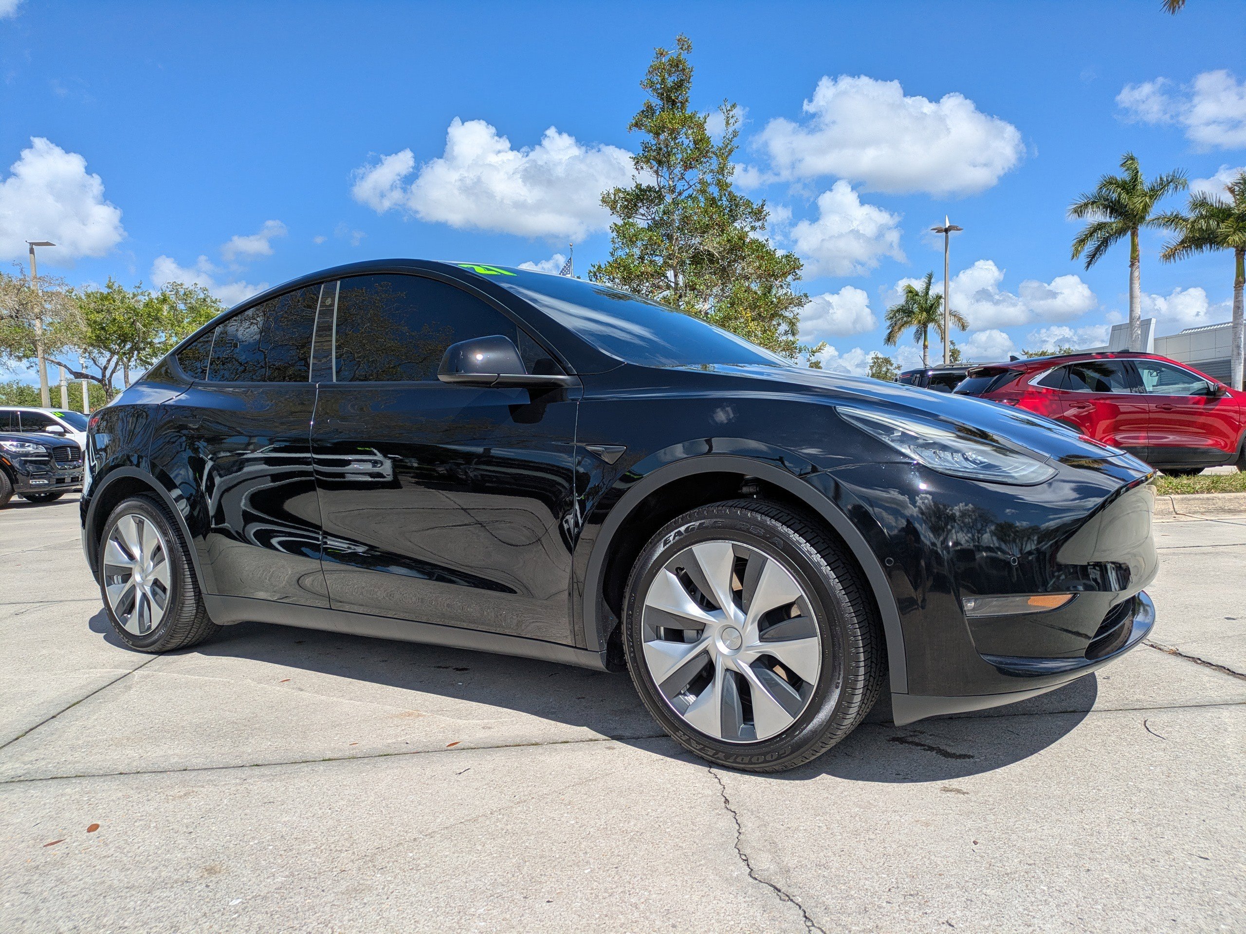 Used 2021 Tesla Model Y Standard Range with VIN 5YJYGDED7MF103781 for sale in Naples, FL