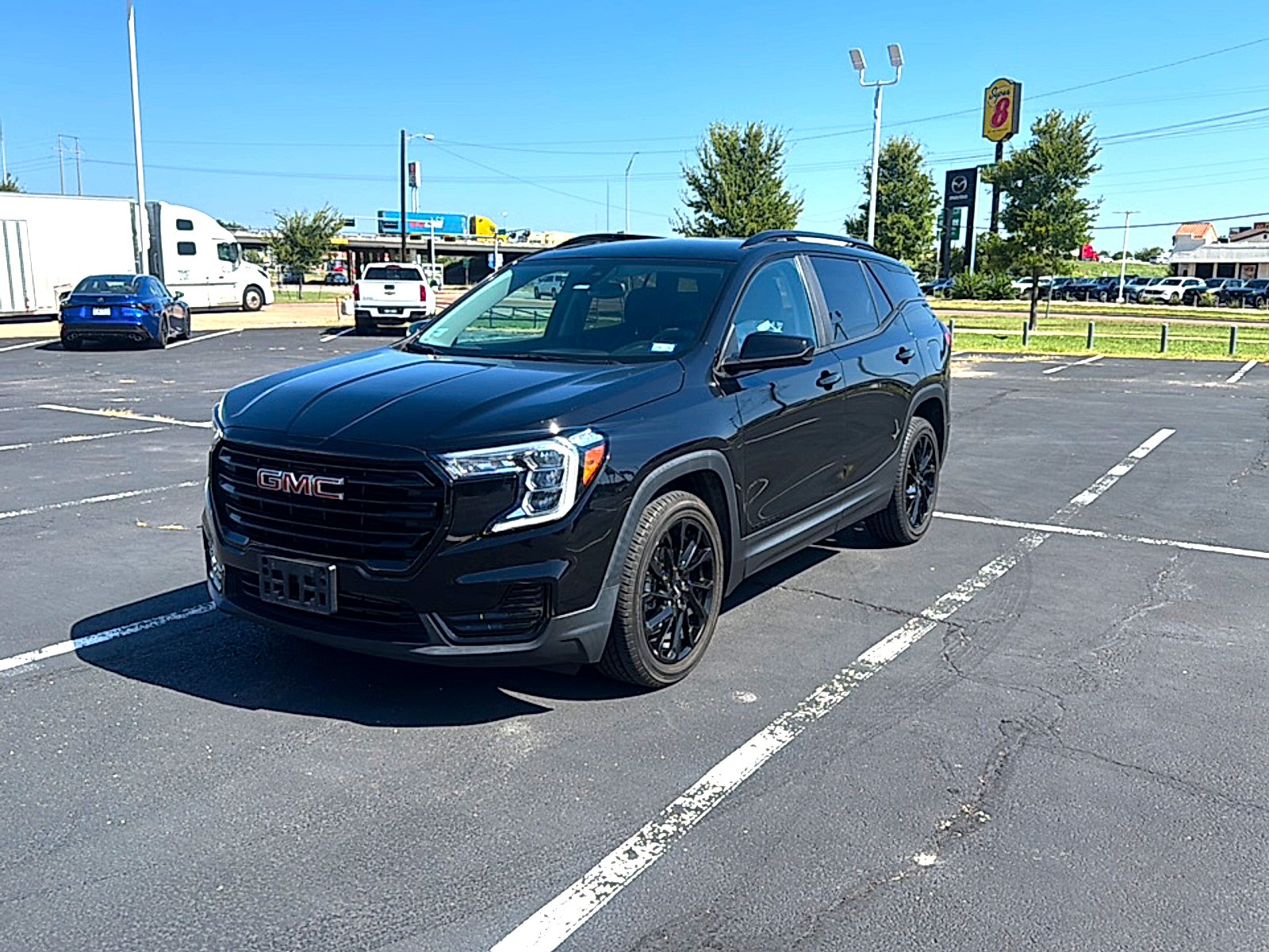 Used 2024 Ebony Twilight Metallic GMC SLE image 2