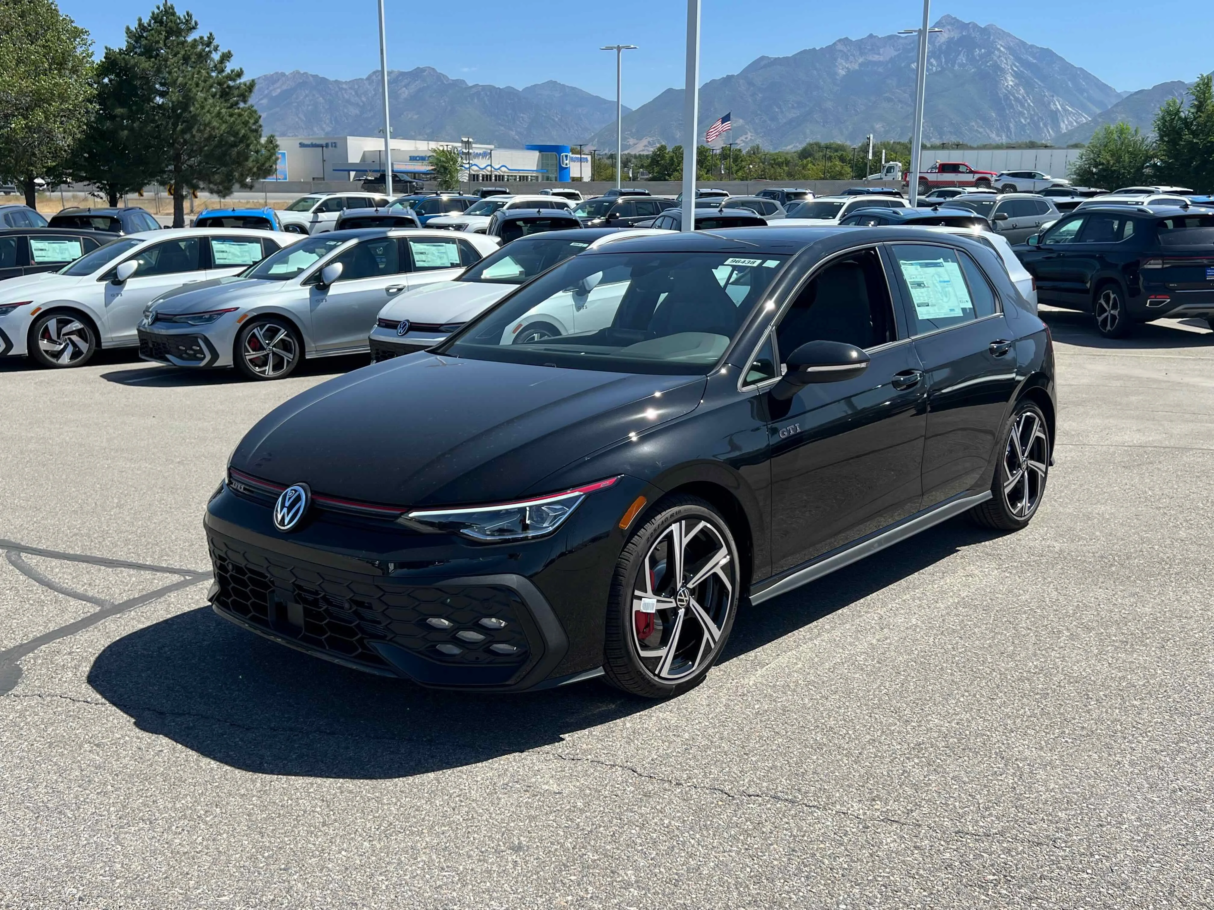 New 2025 Black Volkswagen SE image 1