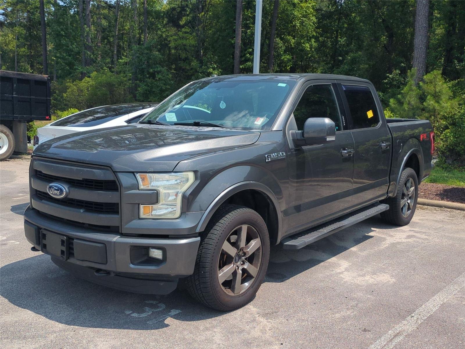 Used 2015 Magnetic Metallic Ford Lariat image 1