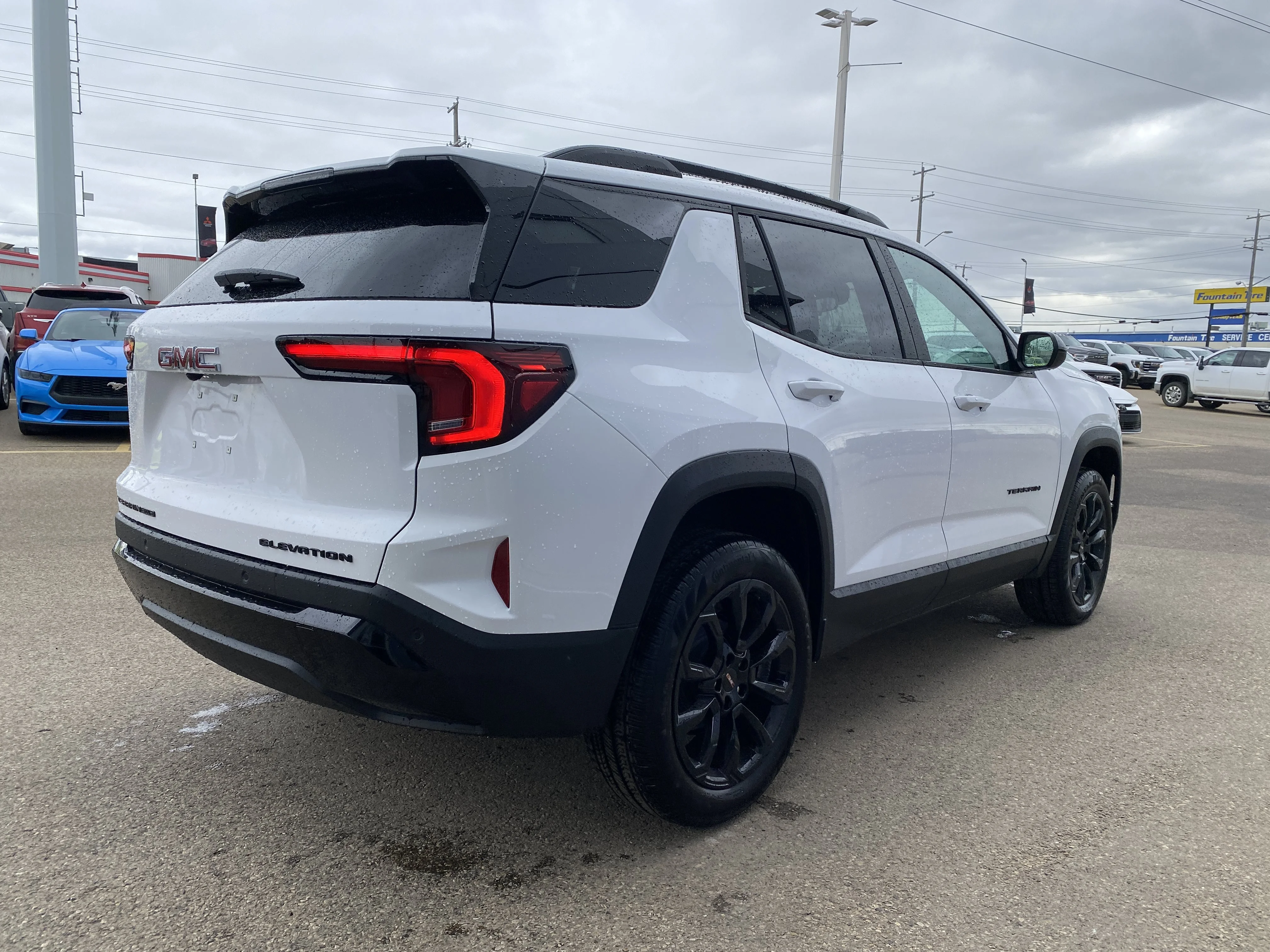 New 2026 Summit White GMC AWD Elevation image 7