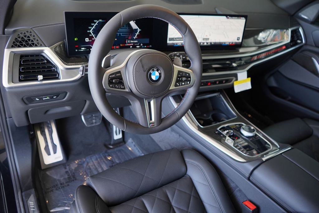 Used 2026 Black Sapphire Metallic BMW M60i image 13