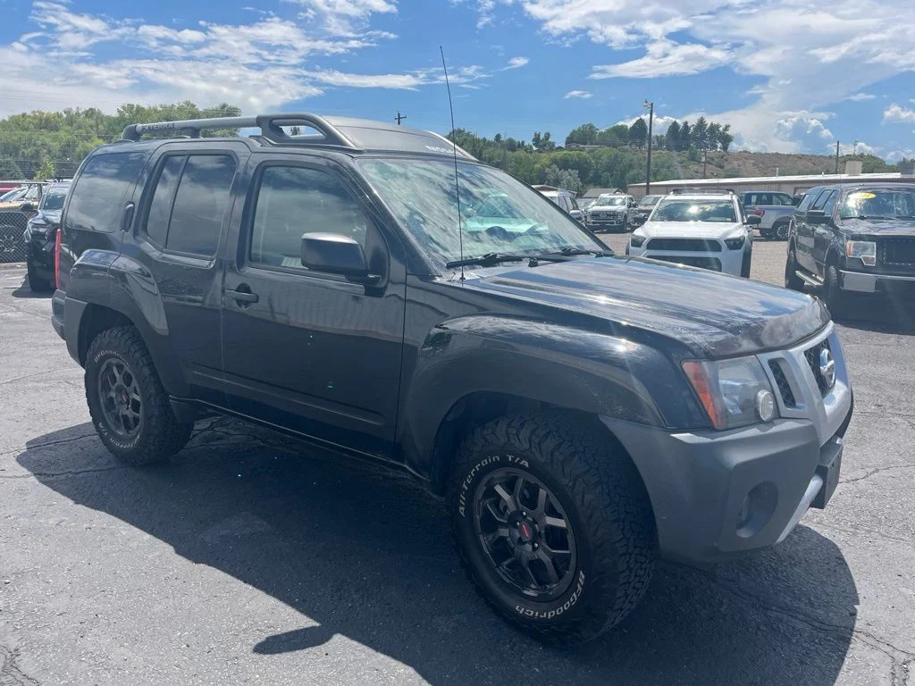 Used 2015 Super Black Nissan X image 1