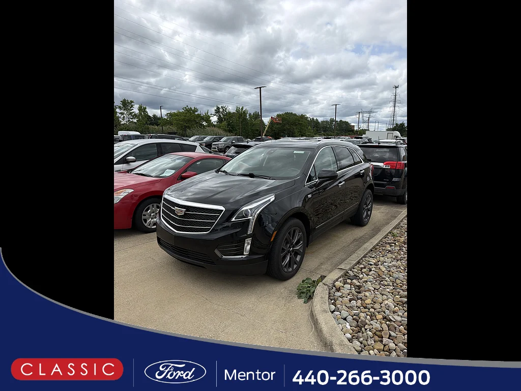 Used 2019 Stellar Black Metallic Cadillac Luxury image 1