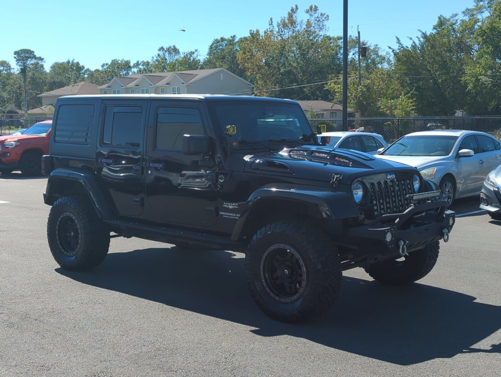 Used 2015 Black Jeep Unlimited Sahara image 9