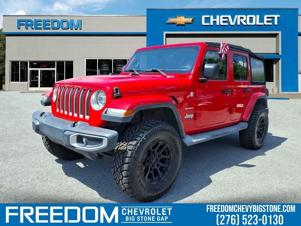 Used 2018 Red Jeep Unlimited Sahara image 1