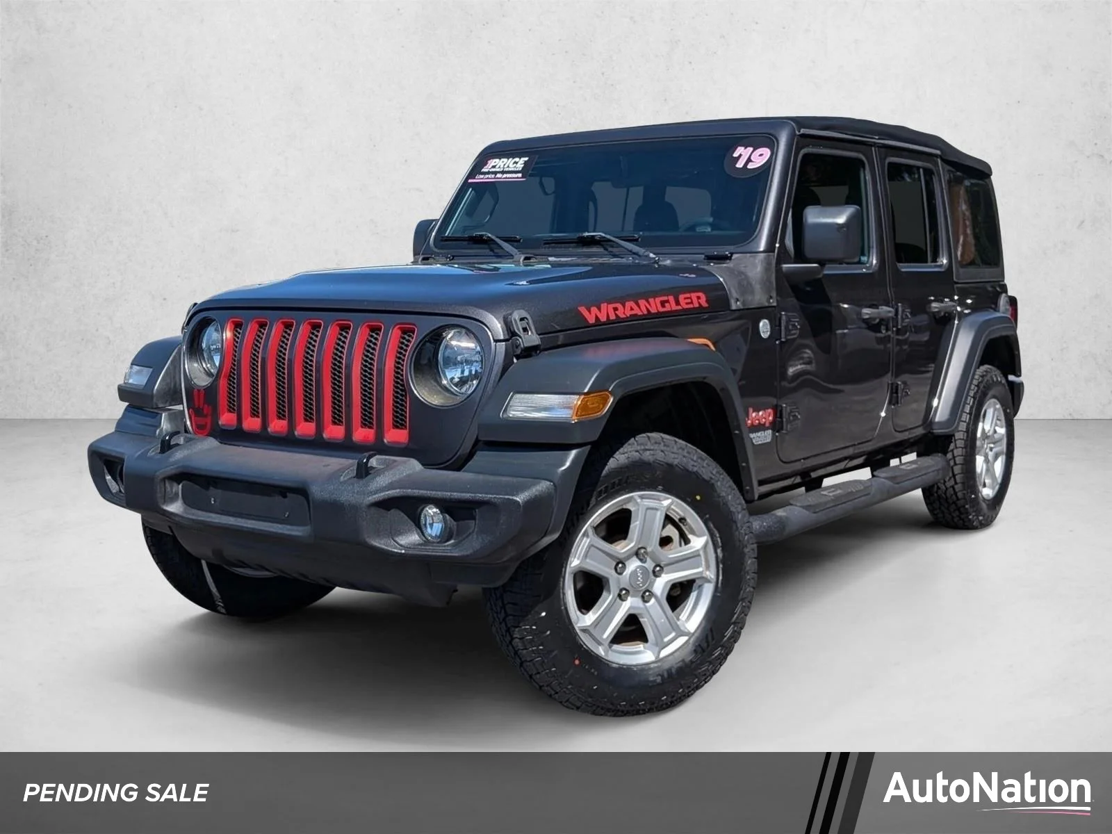 Used 2019 Granite Crystal Metallic Clearcoat Jeep Sport S image 1