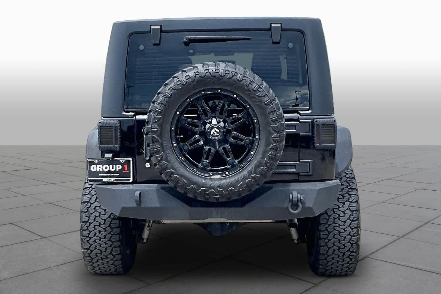 Used 2014 Black Clearcoat Jeep Sport image 5
