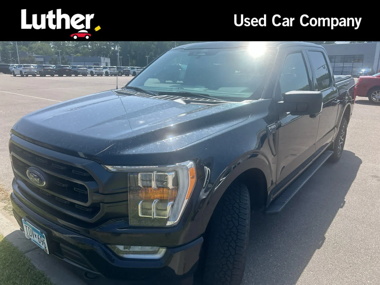 Used 2021 Agate Black Metallic Ford XLT image 1