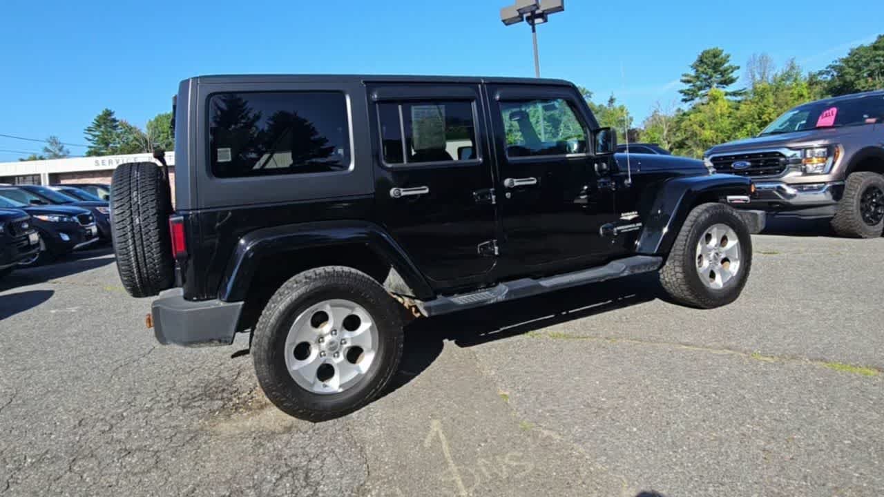 Used 2014 Black Clear Coat Jeep Sahara image 8