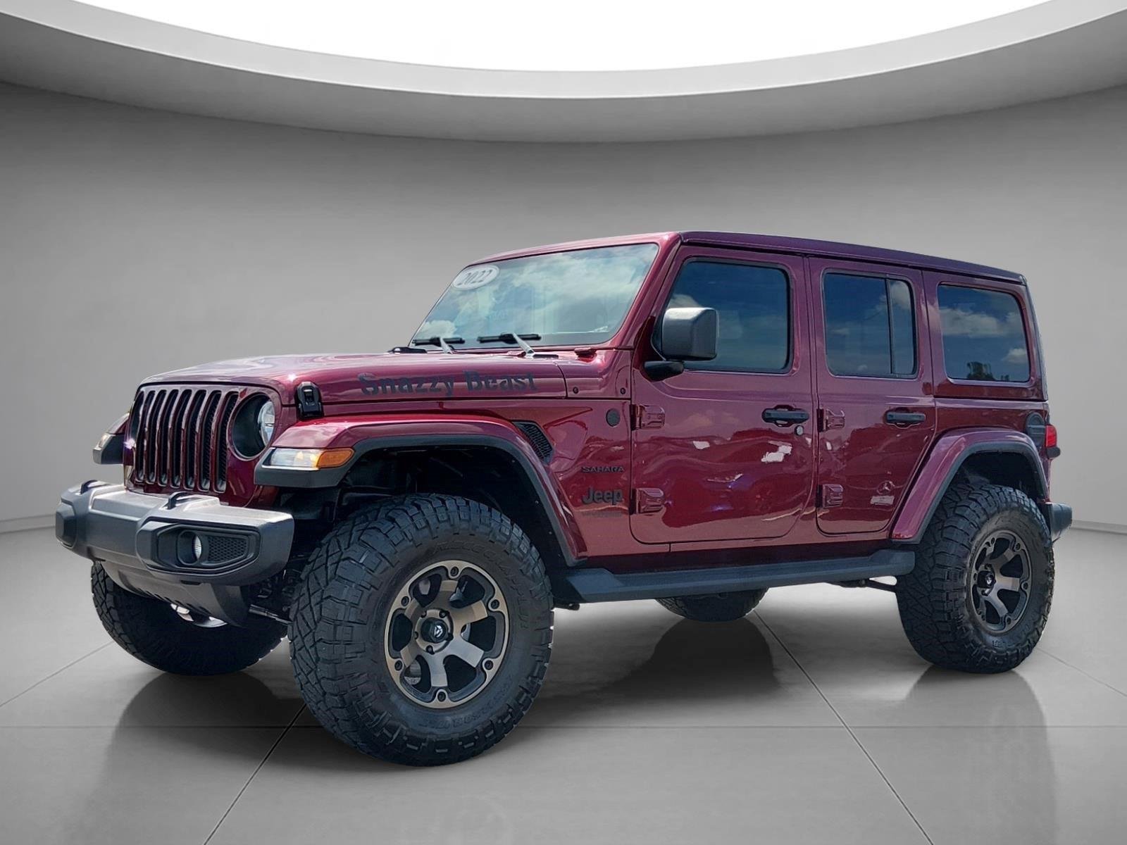Used 2022 Snazzberry Pearlcoat Jeep Unlimited Sahara image 1