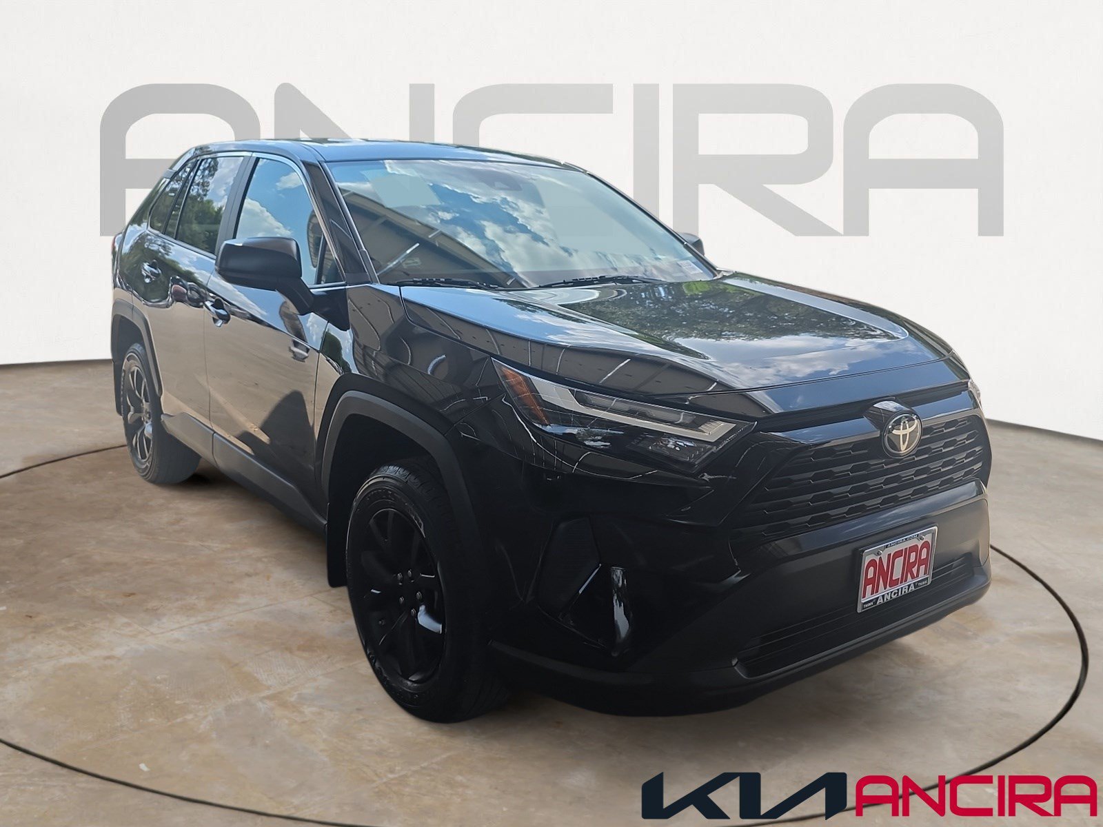 Used 2023 Midnight Black Metallic Toyota LE image 1