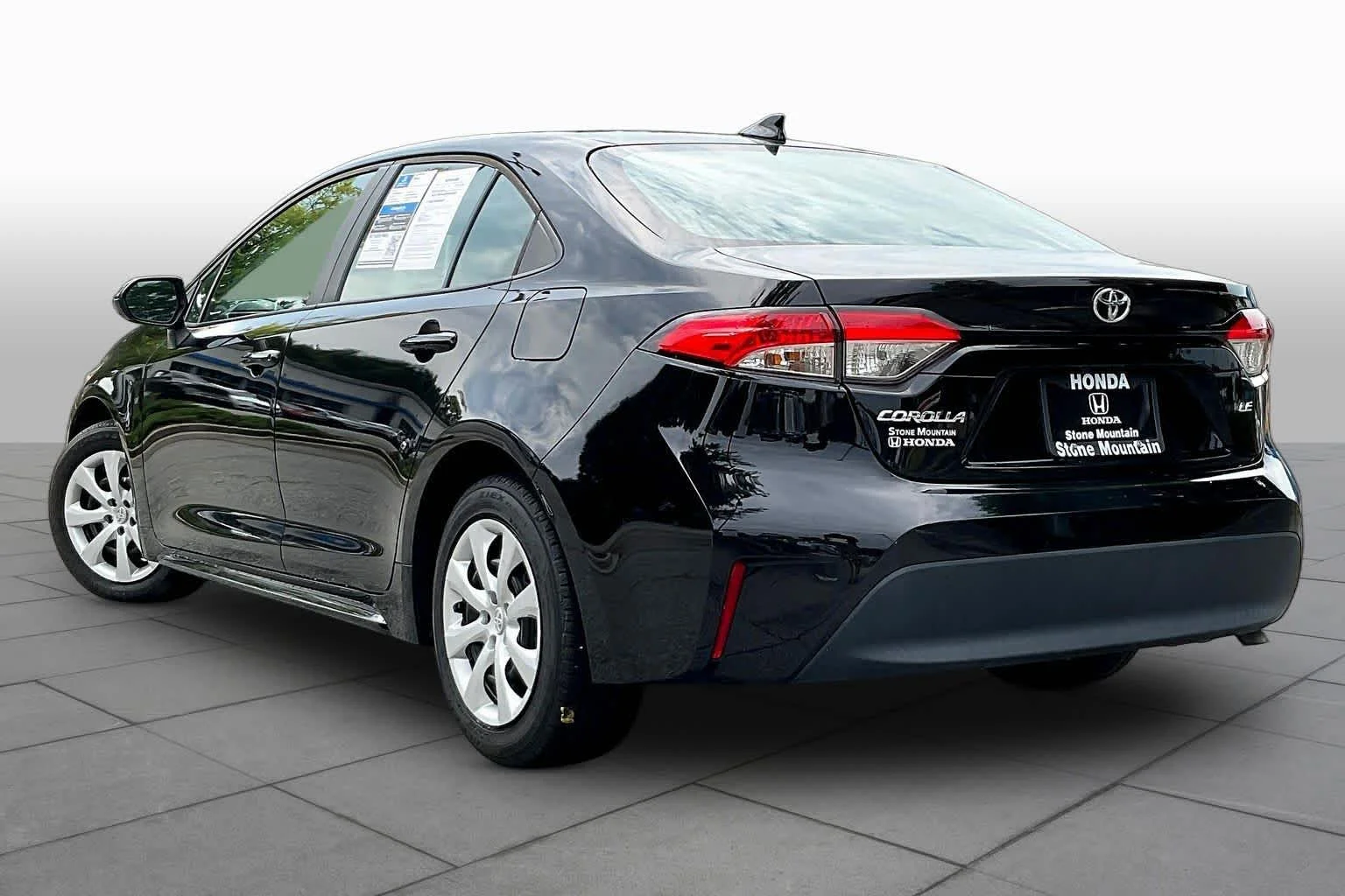 Used 2024 Midnight Black Metallic Toyota LE image 12