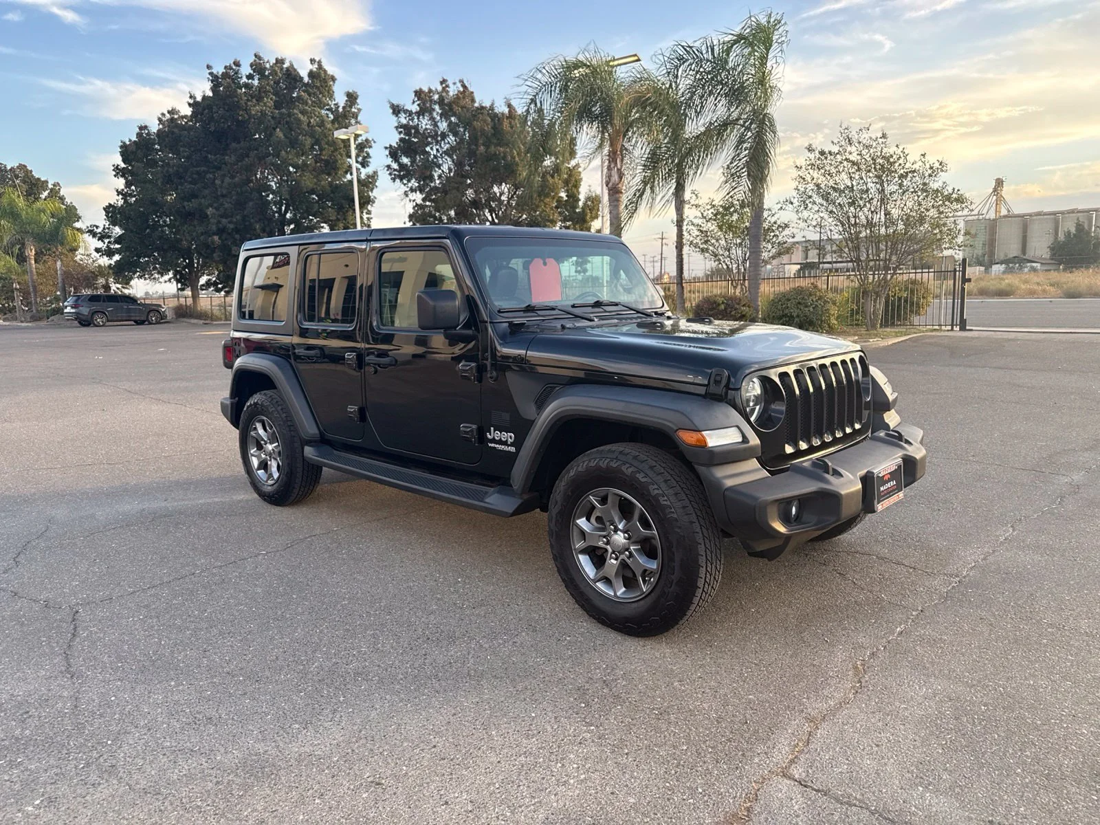 Used 2020 Black Jeep Unlimited Sport image 1