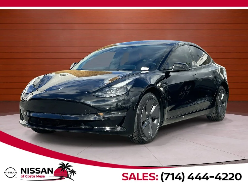 Used 2023 Solid Black Tesla Base image 1