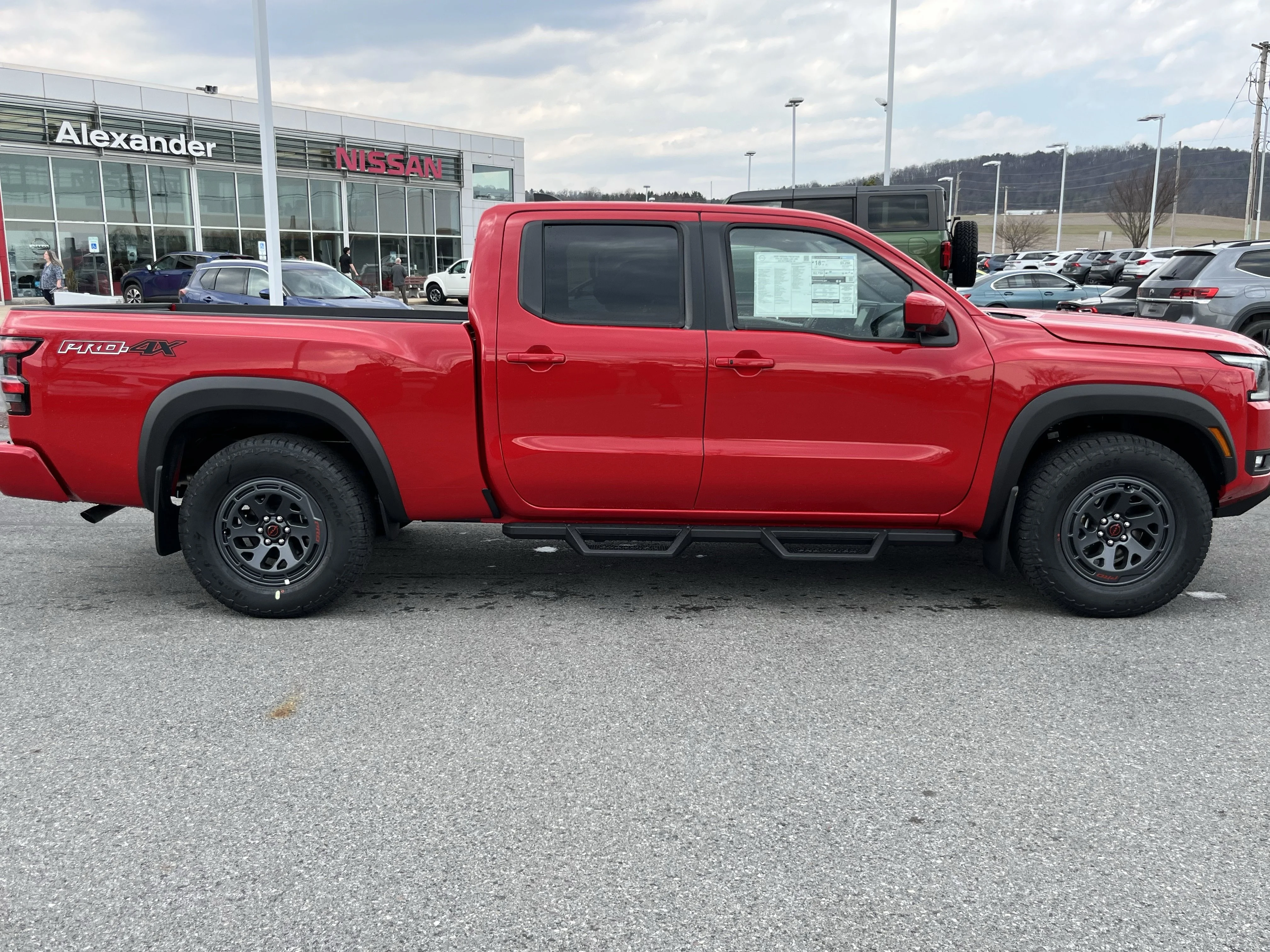 New 2026 Red Alert Nissan Crew Cab PRO-4X® Long Bed image 1