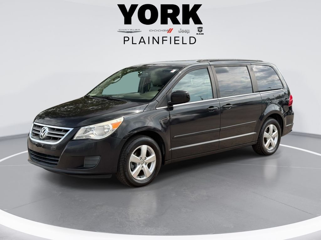 Used 2011 Black Volkswagen SE image 1