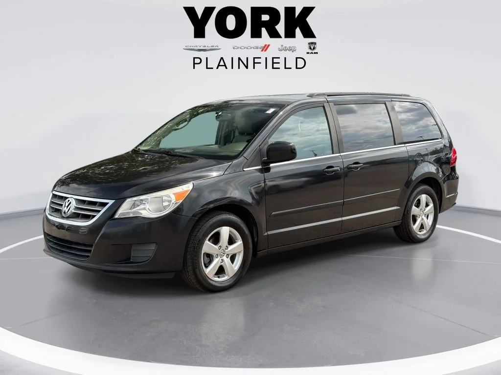 Used 2011 Black Volkswagen SE image 1
