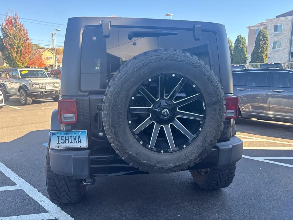 Used 2018 Black Jeep Unlimited Sahara image 6