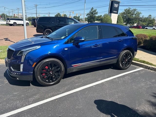 Used 2025 Blue Cadillac Sport image 1
