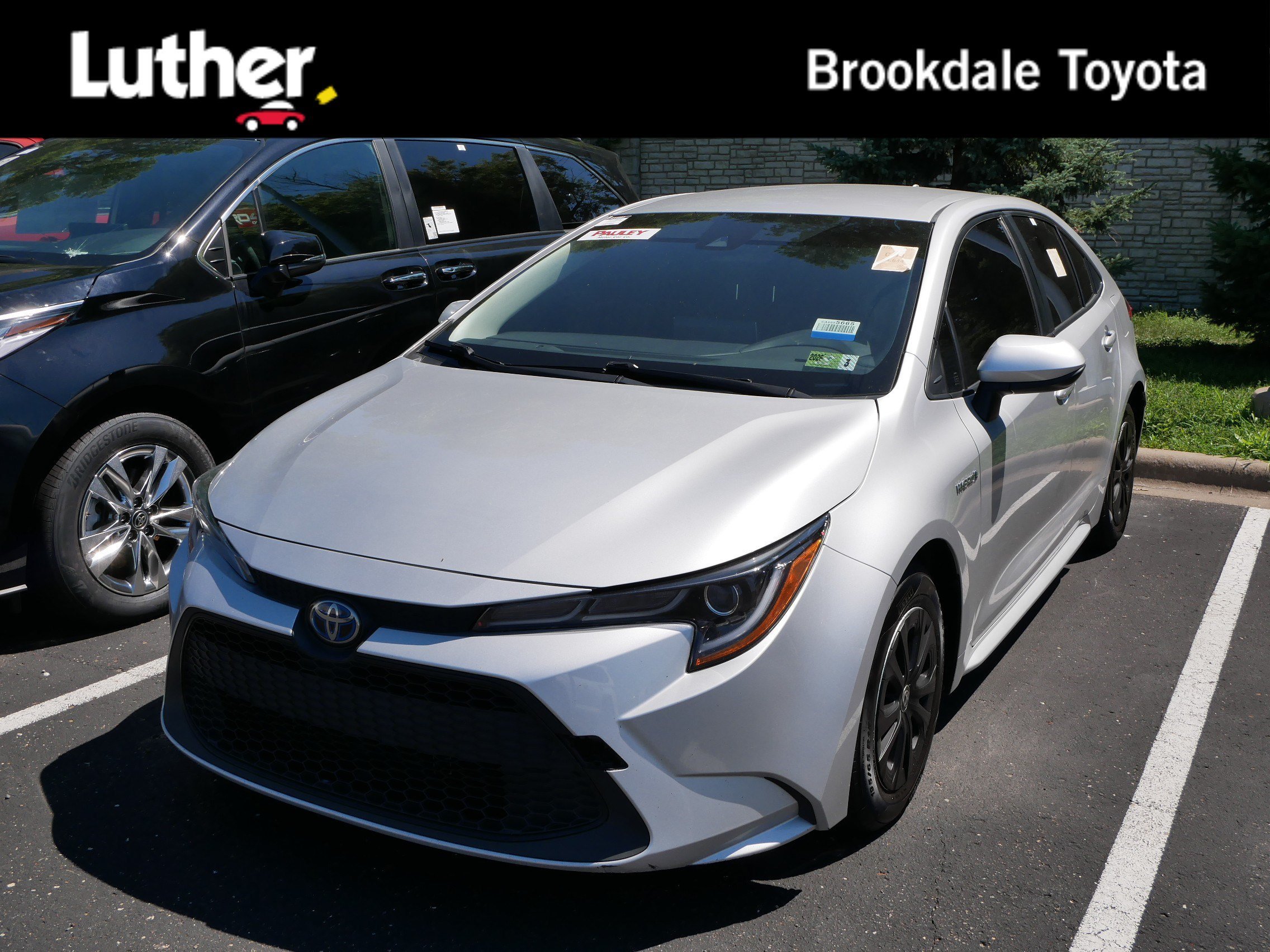 Certified Used 2021 CLASSIC SILVER MET Toyota Hybrid LE image 1