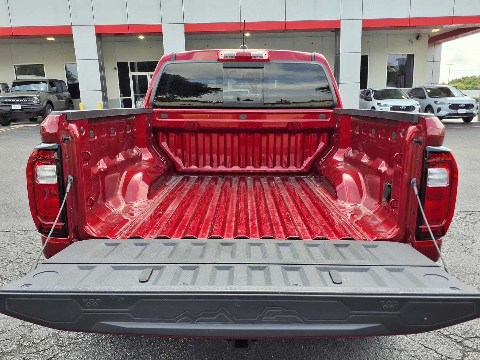 Used 2024 Volcanic Red Tintcoat GMC 2WD Elevation image 10