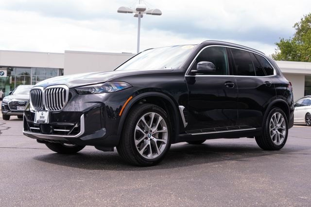 Certified Used 2025 Black Sapphire Metallic BMW xDrive40i image 1