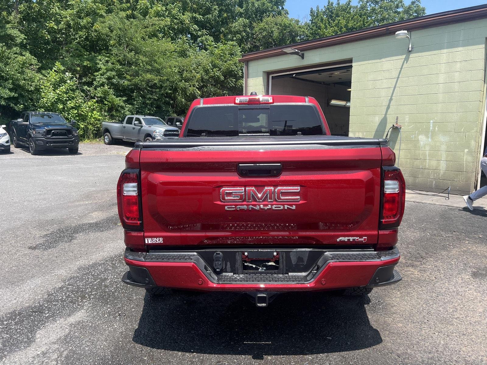 Used 2024 Volcanic Red Tintcoat GMC 4WD AT4 image 4