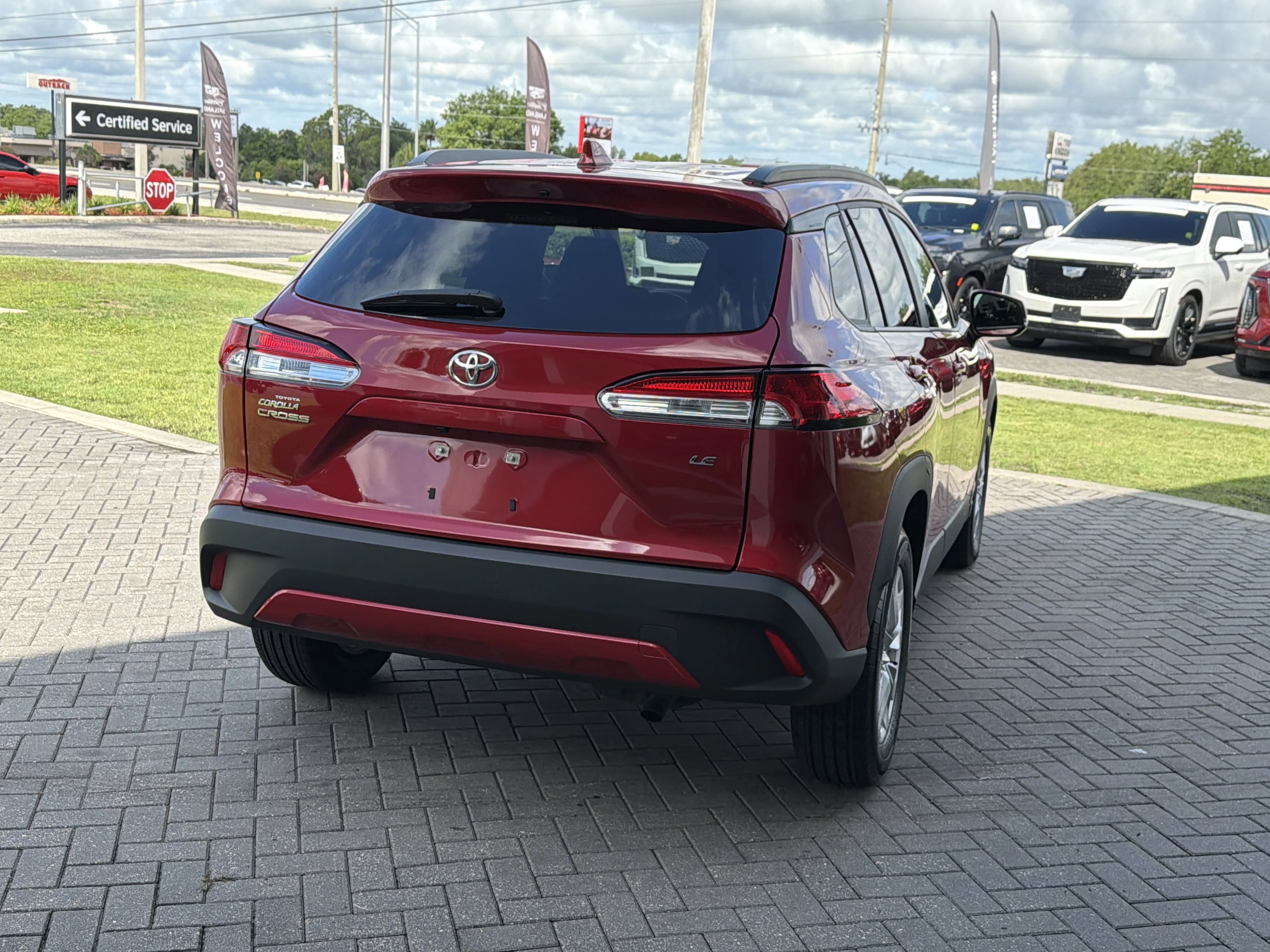 Used 2023 Barcelona Red Metallic Toyota LE image 6