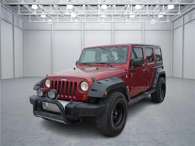 Used 2011 Red Jeep Sahara 4x4 image 1
