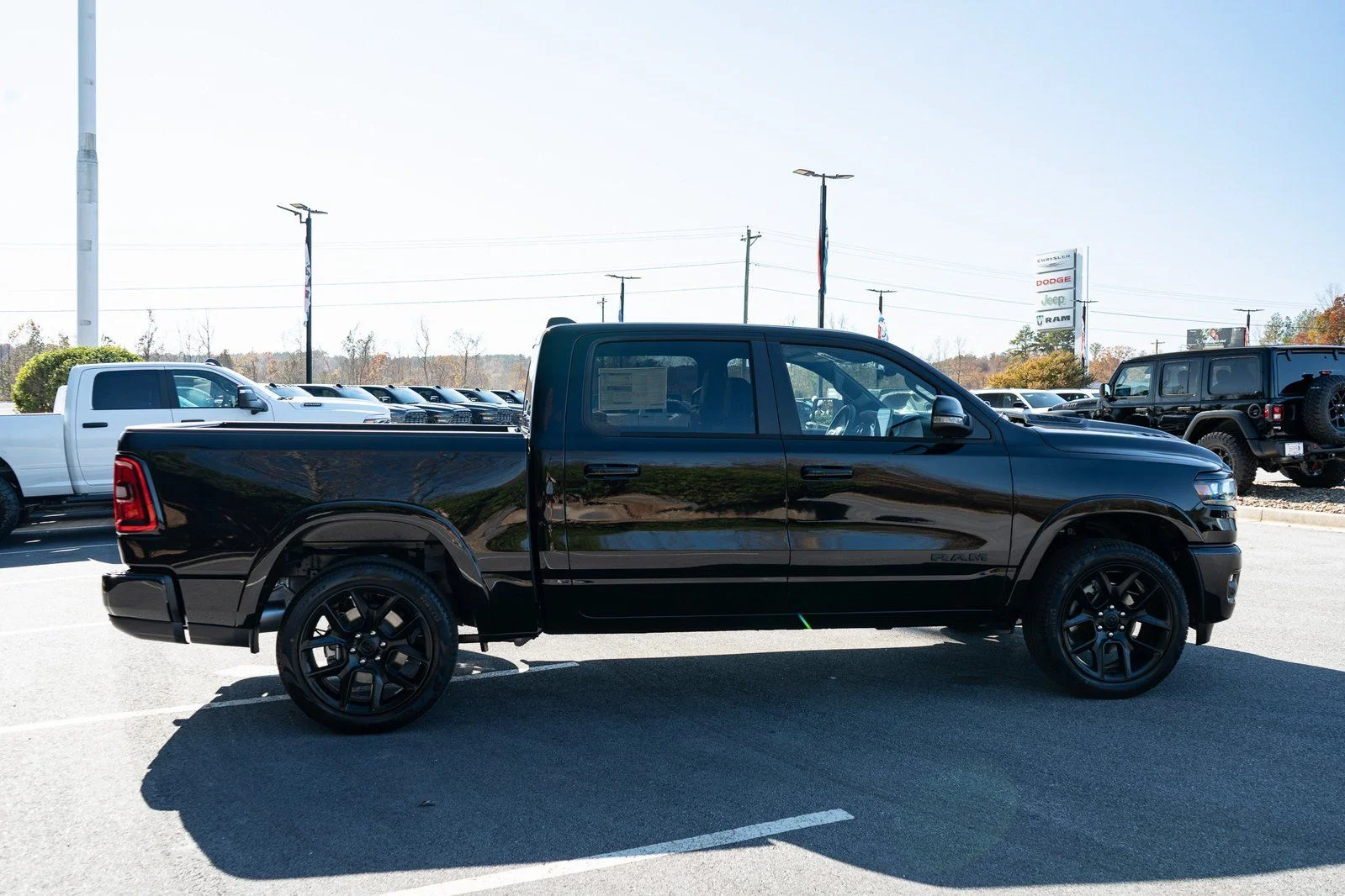 New 2026 Diamond Black Crystal Pearl-Coat Exterior Paint RAM Laramie image 11