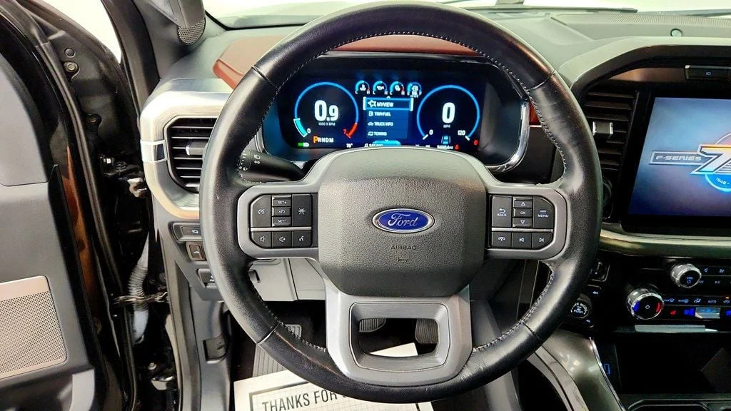 Used 2023 Agate Black Metallic Ford LARIAT 4WD SuperCrew 5.5
