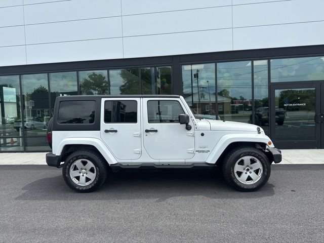 Used 2011 Jeep Wrangler Unlimited Sahara with VIN 1J4BA5H14BL638165 for sale in Seekonk, MA