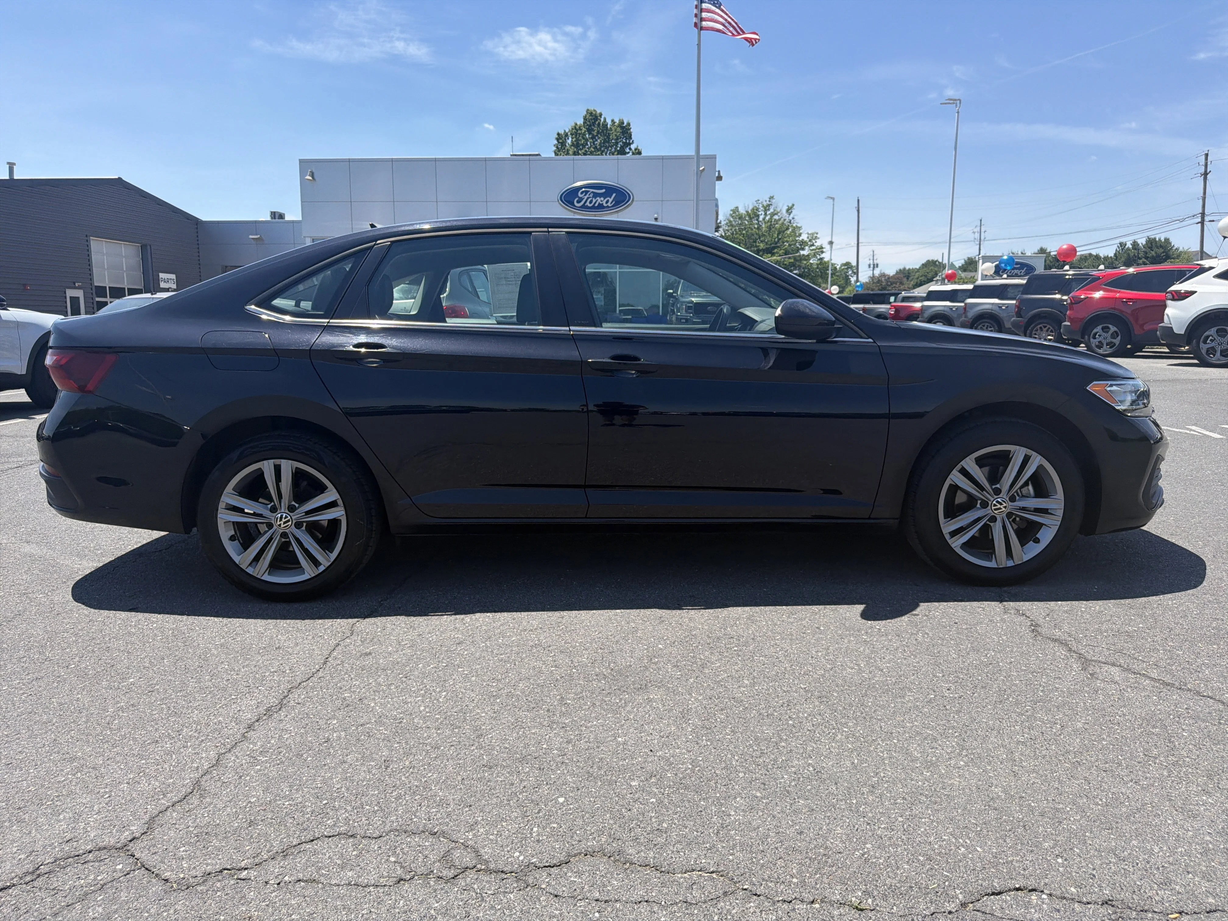 Used 2024 Black Volkswagen SE image 2