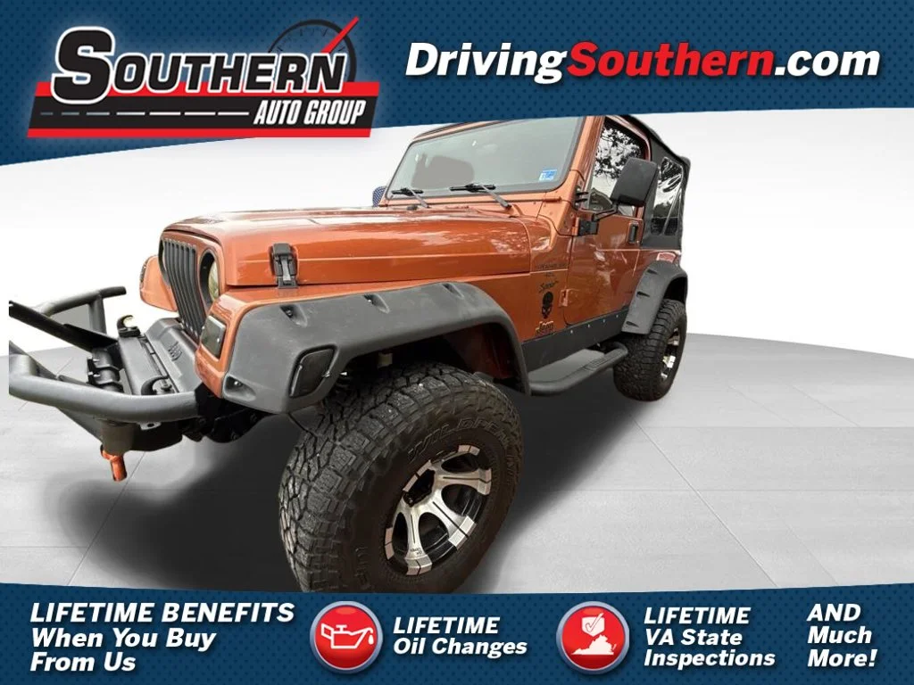 Used 2000 Orange Jeep Sport image 1