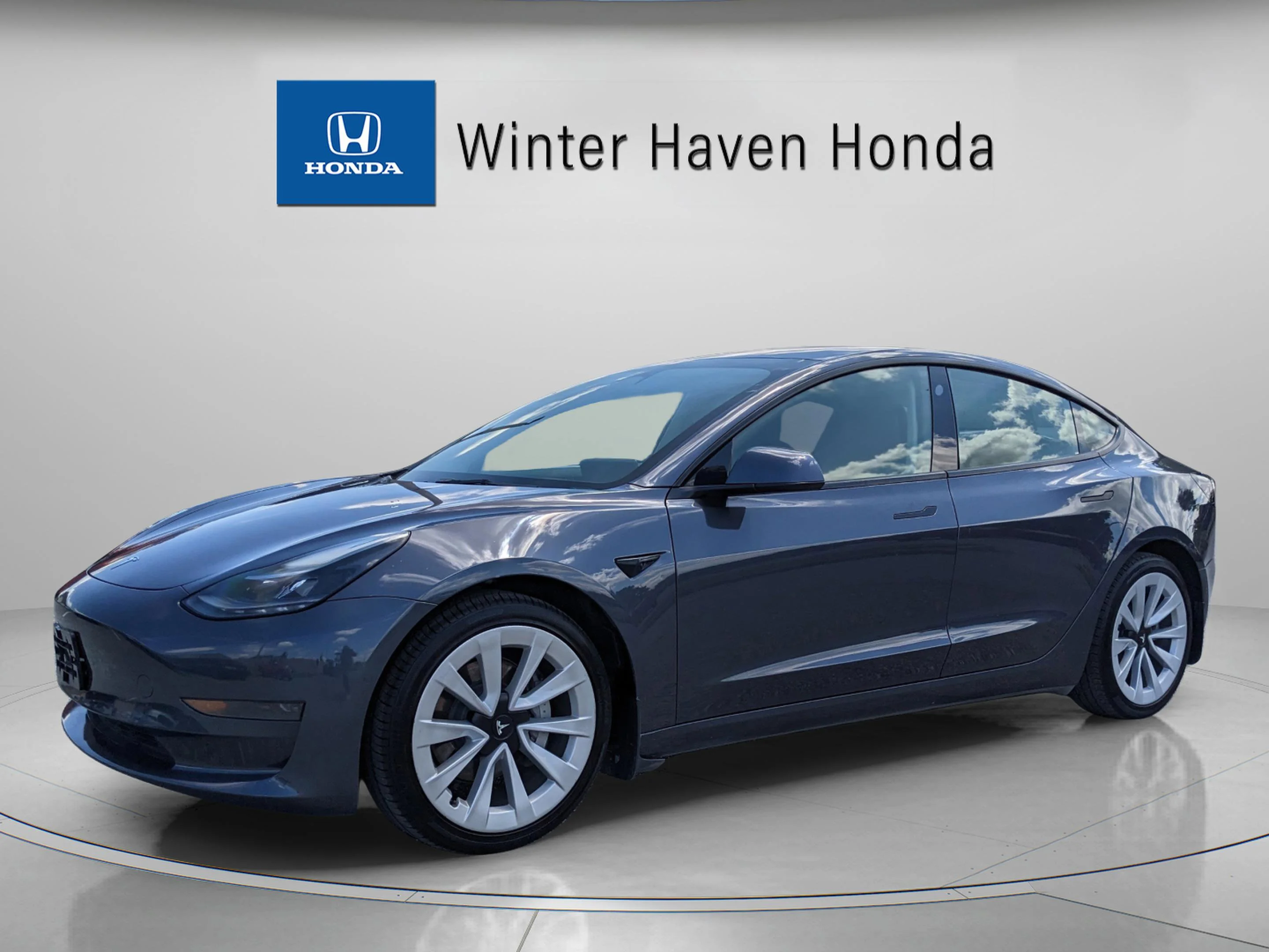 Used 2022 Tesla Model 3 Base with VIN 5YJ3E1EAXNF235097 for sale in Winter Haven, FL